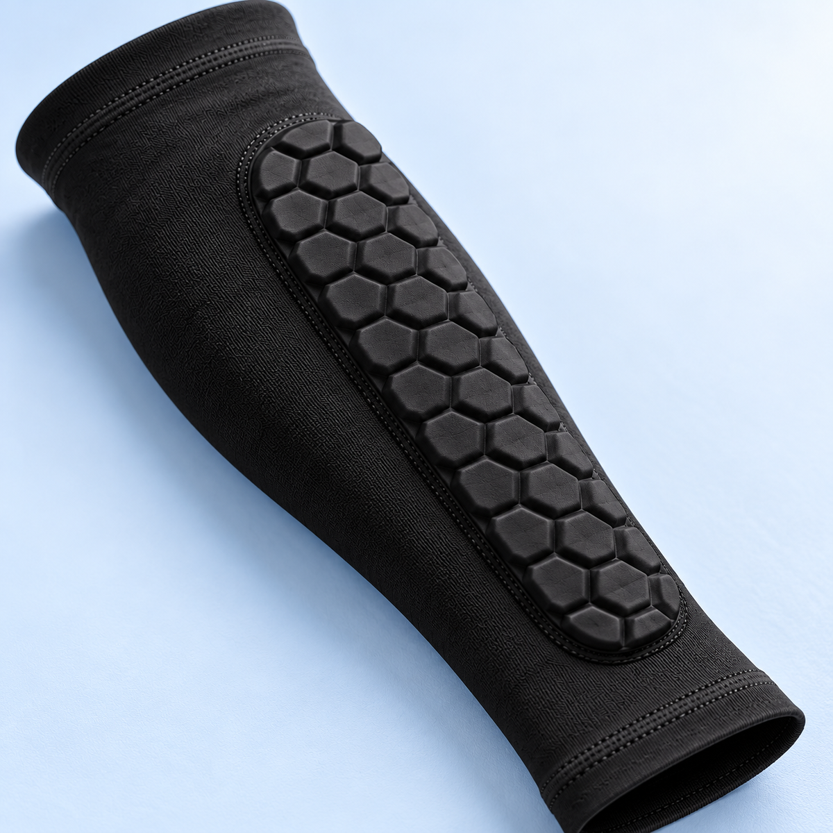 Hexagonal shin cushioning and sleeve fabric detail