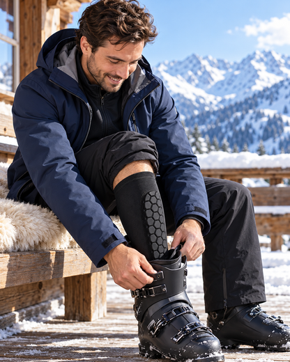 Skier adjusting a boot with a ShinBuddy sleeve
